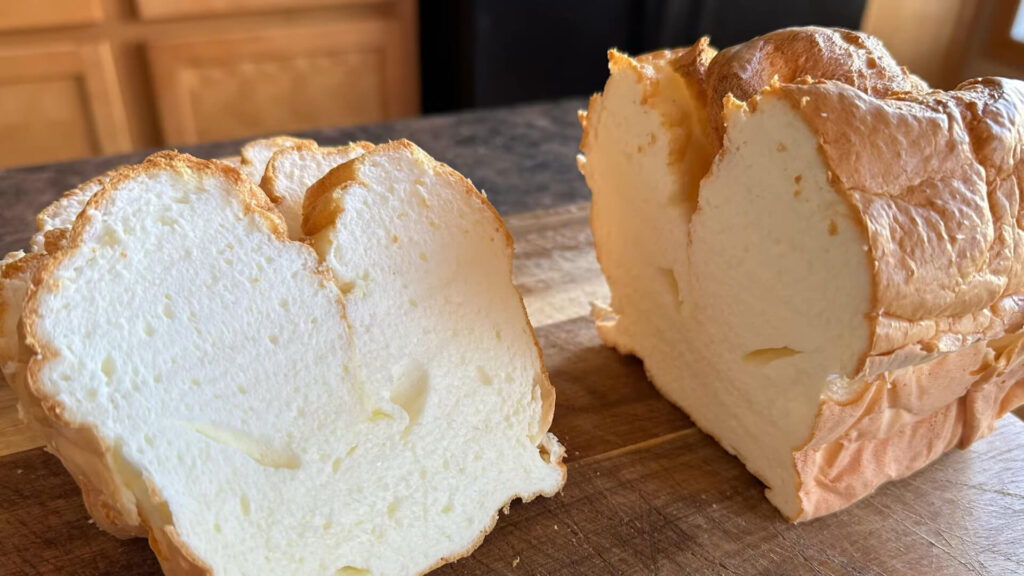 Fluffy, golden-brown cloud bread cooling on a wire rack